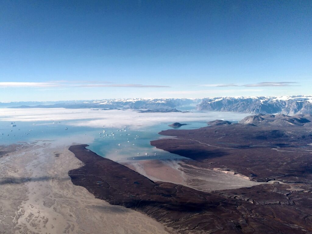 View of river delta and fjord with icebergs.